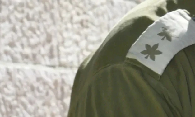 October 7 intelligence officer fights to keep his identity secret