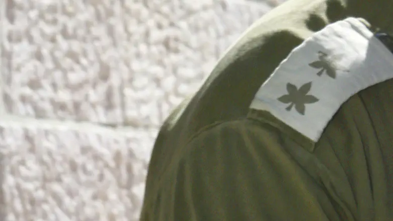 October 7 intelligence officer fights to keep his identity secret