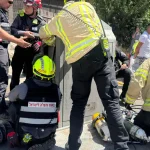Dramatic rescue: Man pulled alive from underground Jerusalem garbage container