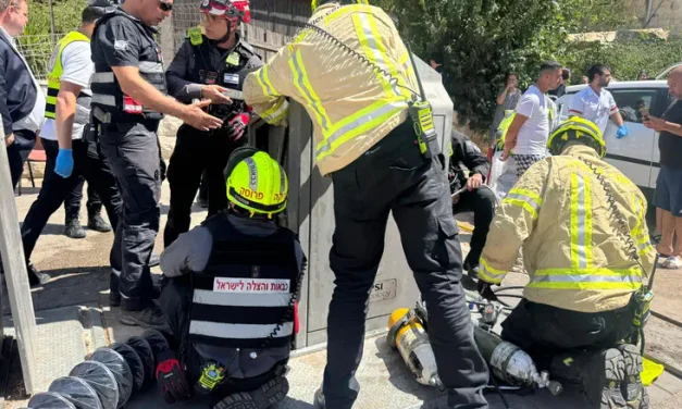Dramatic rescue: Man pulled alive from underground Jerusalem garbage container