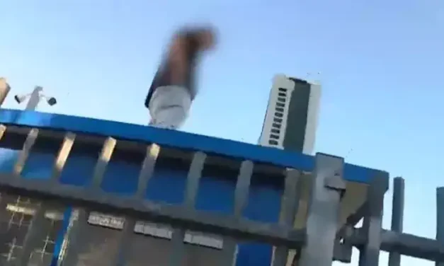 Watch: Police chase ends on top of a school guard booth