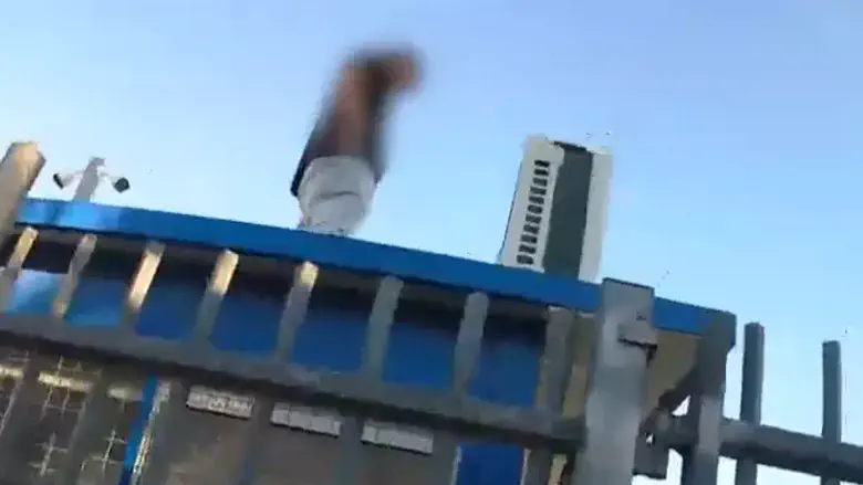 Watch: Police chase ends on top of a school guard booth