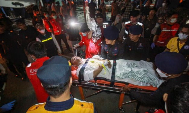 Search underway for some 130 people after Indonesian ferry overturns