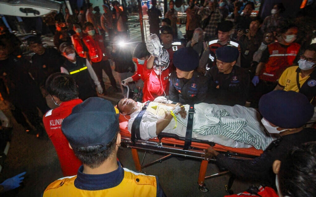 Search underway for some 130 people after Indonesian ferry overturns