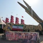 Iran vows to take preemptive action against threats, as it touts improved ballistic missile