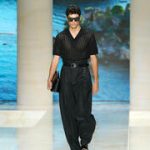 Men’s clutch bags are everywhere, and fashion’s latest status symbol is anything but practical