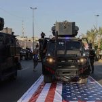Iran-backed militias trample US flag, exposing Iraq’s sovereignty problem – analysis
