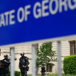 Georgia, US, block party shooting kills two, wounds dozens, officials say