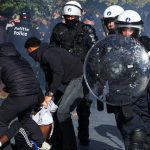 Protesters clash with police in Brussels as anti-government demonstrations spread across Europe