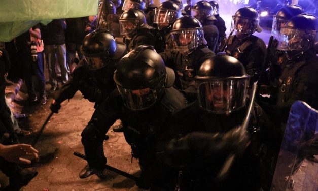Hundred arrested in Barcelona as youth-led ‘anti-system’ riots leave trail of fires, looted shops