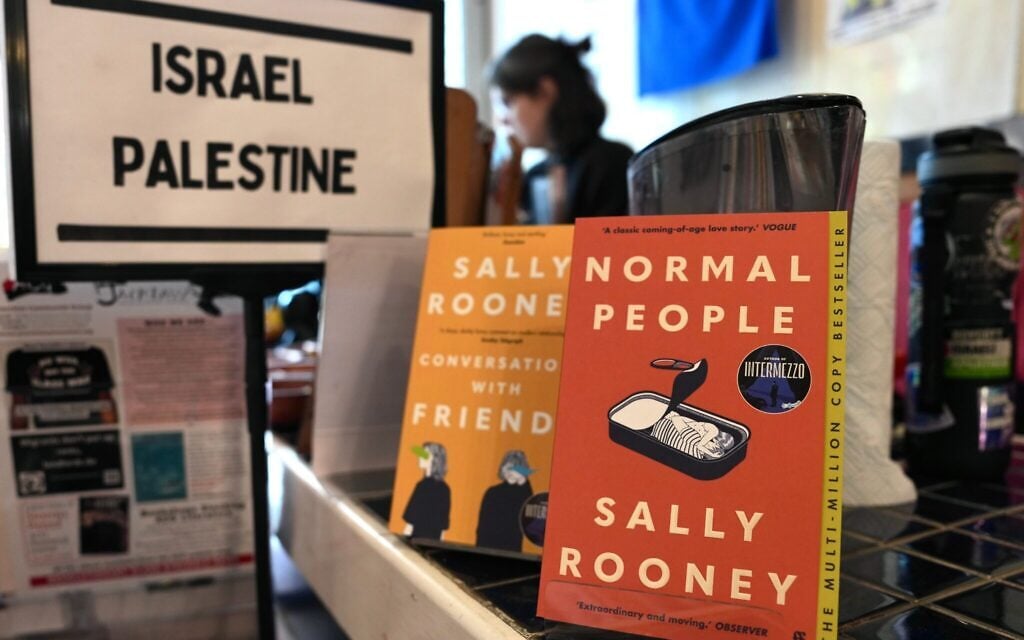 Authors urge UK to halt ‘draconian’ Palestine Action ban as Rooney sales end