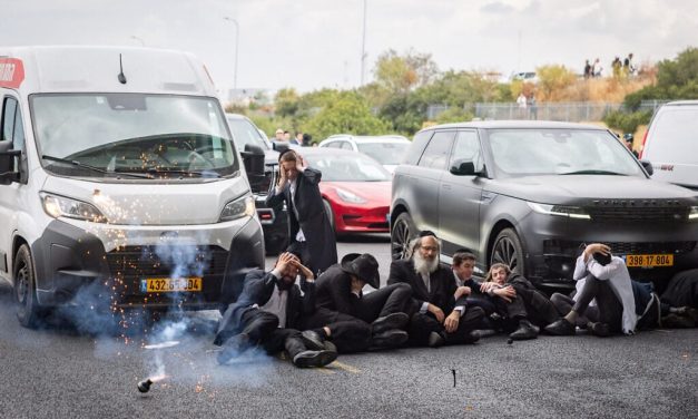 Ultra-Orthodox block main highway in rush hour protest over draft dodgers’ arrest