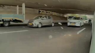 Man hurls rocks at cars from bridge over major Tel Aviv highway, then flees | Watch