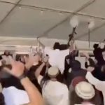 Rifle-wielding settler extremists filmed dancing at wedding to anti-Zionist anthem