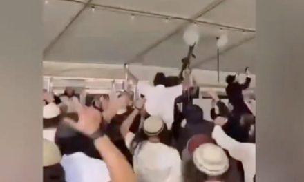 Rifle-wielding settler extremists filmed dancing at wedding to anti-Zionist anthem